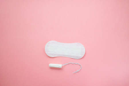 women intimate hygiene products - sanitary pads and tampon on pink background.の写真素材