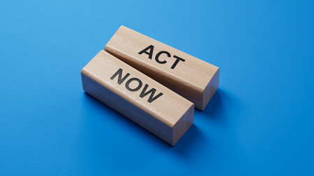 Act now symbol. wooden blocks with words Act now.Business and Act now concept. Copy space.3D rendering on blue background.の写真素材