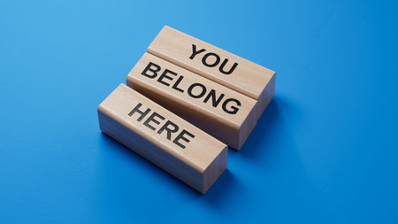 You belong here symbol. wooden blocks with words You belong here.Business and You belong here concept. wooden blocks. Copy space.3D rendering on blue background.の写真素材