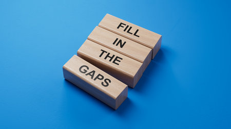 Fill in the gaps symbol. Concept words fill in the gaps on wooden blocks. Business and fill in the gaps concept. 3D rendering on blue background.の写真素材