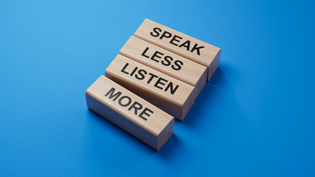 Speak less Listen more symbol. wooden blocks with words Speak less Listen more.Business and Speak less Listen more concept. Copy space.3D rendering on blue background.の写真素材