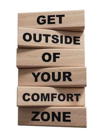 Get outside of your comfort zone symbol. Concept words Get outside of your comfort zone on wooden blocks.Business concept. Copy space.Supports PNG files with transparent backgrounds.の写真素材