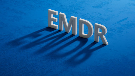 The text EMDR word Eye Movement Desensitization is written on notepad. Medical concept. close up of shadow of 3d characters.の写真素材