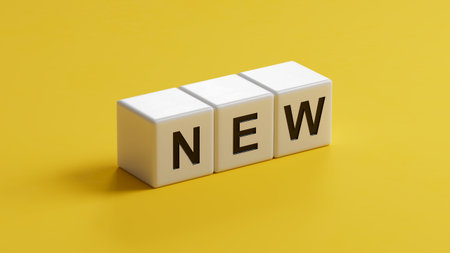 NEW text on wooden cubes.3D rendering on yellow background.