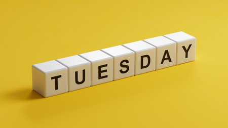 Tuesday.wooden cubes spelling.Flat lay view with wooden cubes buttons.IT technology concept.3D rendering on yellow background.の写真素材