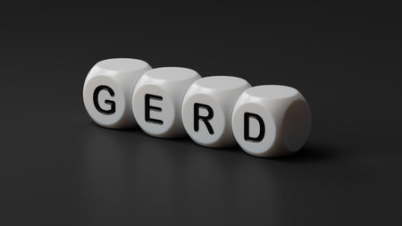 The word GERD is written on wooden dice. Medical concept. Close up of wooden dice. 3D rendering on black background.の写真素材