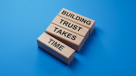 Building Trust takes Time symbol. wooden blocks with words Building Trust takes Time. Business and Building Trust takes Time concept.3D rendering on blue background.の写真素材
