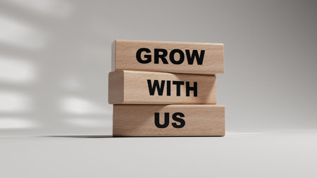 Grow with us symbol. wooden blocks with words Grow with us.Business and Grow with us concept. Copy...