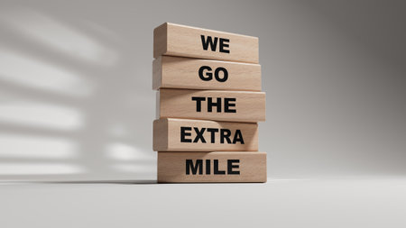 We go the extra mile symbol. wooden blocks with words We go the extra mile. Business and We go the extra mile concept. 3D rendering on white background.の写真素材
