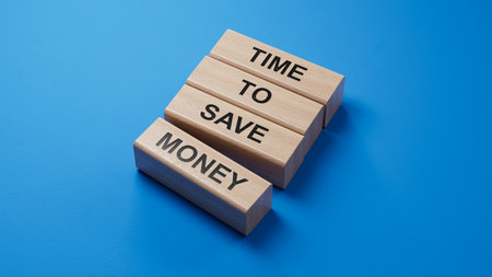 Time to save money symbol. Yellow steaky note with words Time to save money.Business and Time to save money concept. Copy space.3D rendering on blue background.の写真素材