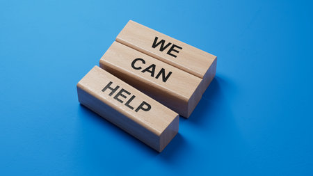 We can help symbol. wooden blocks with words We can help. Business and We can help concept. wooden blocks. Copy space.3D rendering on blue background.の写真素材