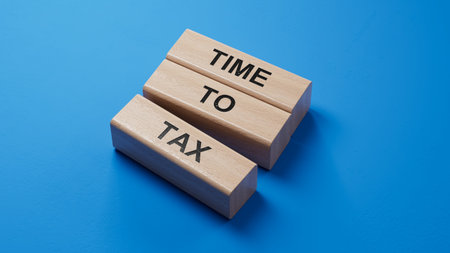 TIME TO TAX - text on wooden blocks. wooden blocks. Copy space.3D rendering on blue background.の写真素材