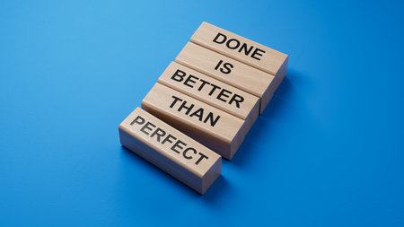 Done is better than Perfect symbol. wooden blocks with words Done is better than Perfect.Business and Done is better than Perfect concept.3D rendering on blue background.の写真素材