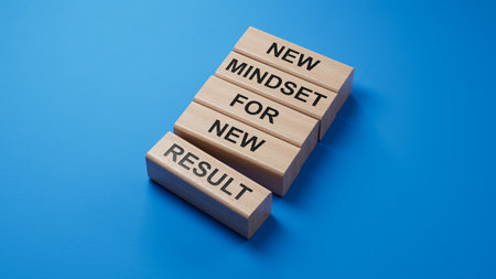 Mindset symbol. wooden blocks with words New Mindset for new Result.Business and New Mindset new Result concept. Copy space.3D rendering on blue background.の写真素材