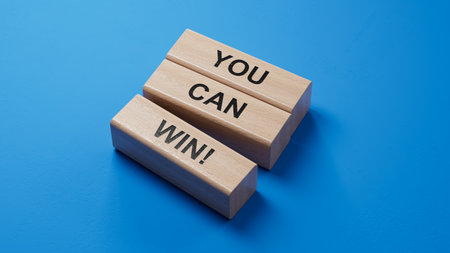 YOU CAN WIN! symbol. wooden blocks.Copy space.3D rendering on blue background.の写真素材