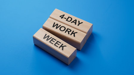 4-day work week symbol. Concept words 4-day work week on wooden blocks.Business and 4-day work week concept. Copy space.3D rendering on blue background.の写真素材