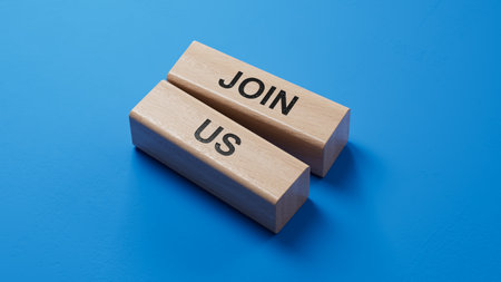 Join us word on wooden blocks on wood table. Copy space.3D rendering on blue background.の写真素材