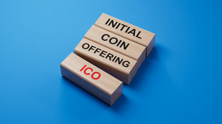 letters of the alphabet of ICO on wooden blocks. ICO - short for initial coin offering. wooden blocks. Copy space.3D rendering on blue background.の写真素材