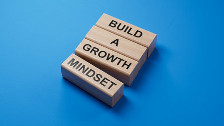 Build a growth mindset symbol. Concept words Build a growth mindset on wooden blocks. Business and Build a growth mindset world concept. 3D rendering on blue background.の写真素材