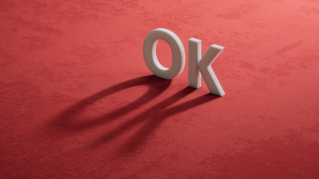 3D illustration of OK in English, using a bold font. It conveys agreement and confidence. Shadow of 3D characters. 3D rendering on red background.の写真素材