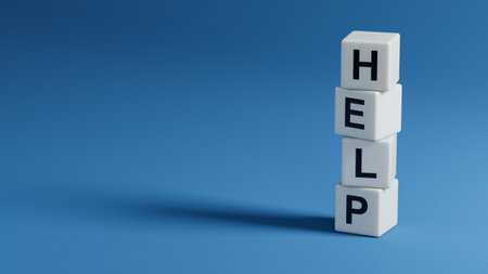 help.wooden elements spelling.Flat lay view from above on wooden elements buttons.IT technology concept.3D rendering on blue background.の写真素材