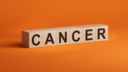 Text CANCER on wooden cubes. Square wood blocks. Top view, flat lay.close up of wooden cubes,Business Concept.3D rendering on orange background.の写真素材