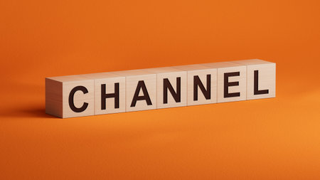 Word CHANNEL made with wooden cubes.close up of wooden cubes,Business Concept.3D rendering on orange background.の写真素材