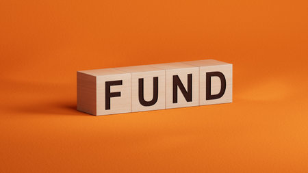FUND Word Written In wooden cubes.close up of wooden cubes,Business Concept.3D rendering on orange background.の写真素材