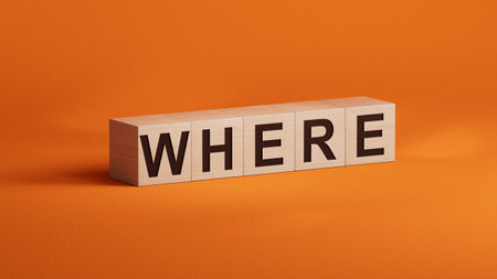 the word spelled out using wooden cubes. Education concept.3D rendering on orange background.の写真素材