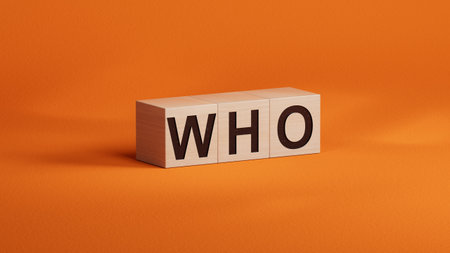 the word spelled out using wooden cubes. Education concept. 3D rendering on orange background.の写真素材