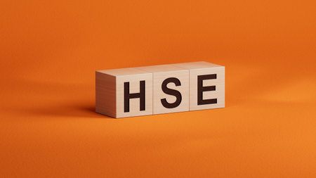 HSE Health Safety Environment acronym on wooden cubes.3D rendering on orange background.の写真素材