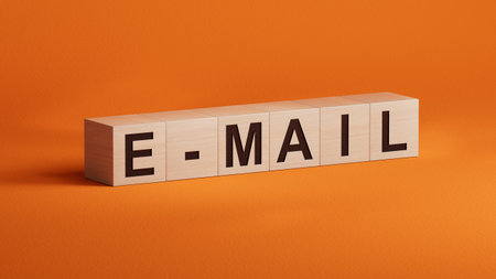 E-Mail.3D illustration of wooden cubes.close up of wooden cubes,3D rendering on orange background.の写真素材