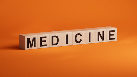 MEDICINE text word on wooden cubes.3D rendering on orange background.の写真素材