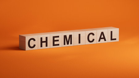 CHEMICAL text word on wooden cubes.3D rendering on orange background.の写真素材