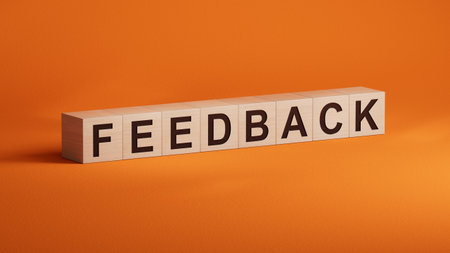 Word FEEDBACK made with wooden cubes. Business concept. Close up of wooden cubes. 3D rendering on orange background.の写真素材