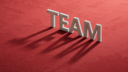 The hand puts a shadow of 3d characters with the letter T from the word Team. The word is written on the shadow of 3d characters. Close up of shadow of 3d characters. 3D rendering on red background.の写真素材