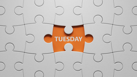 Tuesday. The white puzzle pieces with missing pieces spelling. Flat lay view with the white puzzle pieces with missing pieces buttons. IT technology concept. 3D rendering on orange background.の写真素材