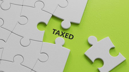 The white puzzle pieces with missing pieces with TAXED business word.close up of The white puzzle pieces with missing pieces,Business Concept.3D rendering on green background.の写真素材