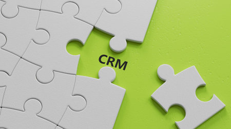 CRM letter on The white puzzle pieces with missing pieces, Customer Relationship Management concept.close up of The white puzzle pieces with missing pieces,Business Concept.3D rendering on green background.の写真素材
