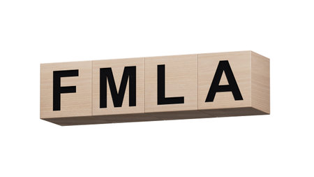 FMLA word written on wooden cubes with copy space.close up of wooden cubes.