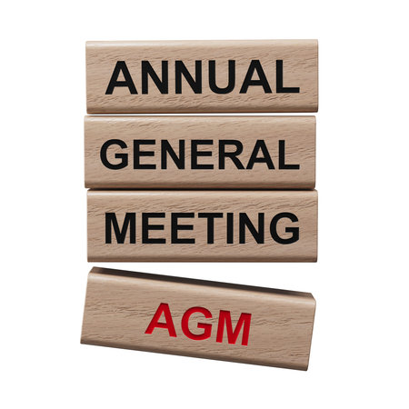 AGM - Annual general meeting symbol. Concept word AGM on wooden blocks. Business and AGM concept....