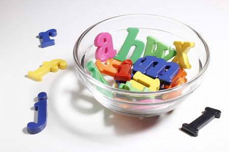 Glass bowl with English alphabetの写真素材