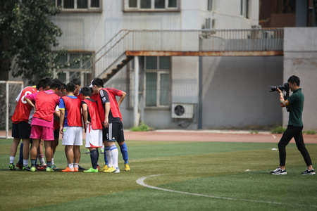Photographer taking photo of a soccer teamのeditorial素材