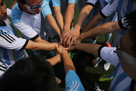 Stack of hands showing unityのeditorial素材