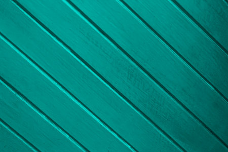 Old and dark turquoise wood panels used as backgroundの写真素材