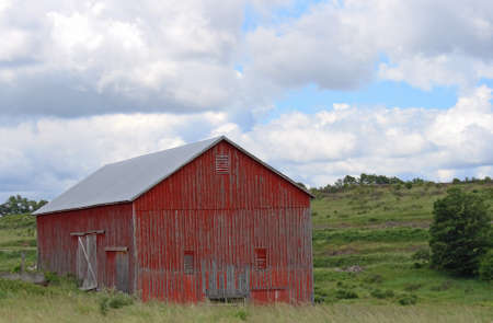 Rural landscape with abandoned barn.の写真素材