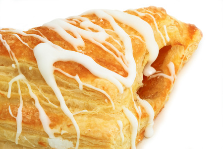 Close up view of an apple pastry, isolated over white.の写真素材