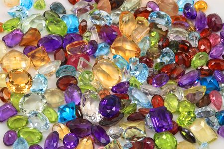 Mixed variety of natural gemstones, including precious and semiprecious gems.の写真素材
