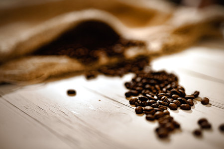 Coffee beans on a wooden background. Selective focus. Toned.