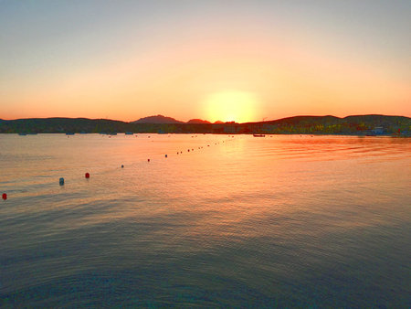 Sunset over the sea in Sardiniaの写真素材